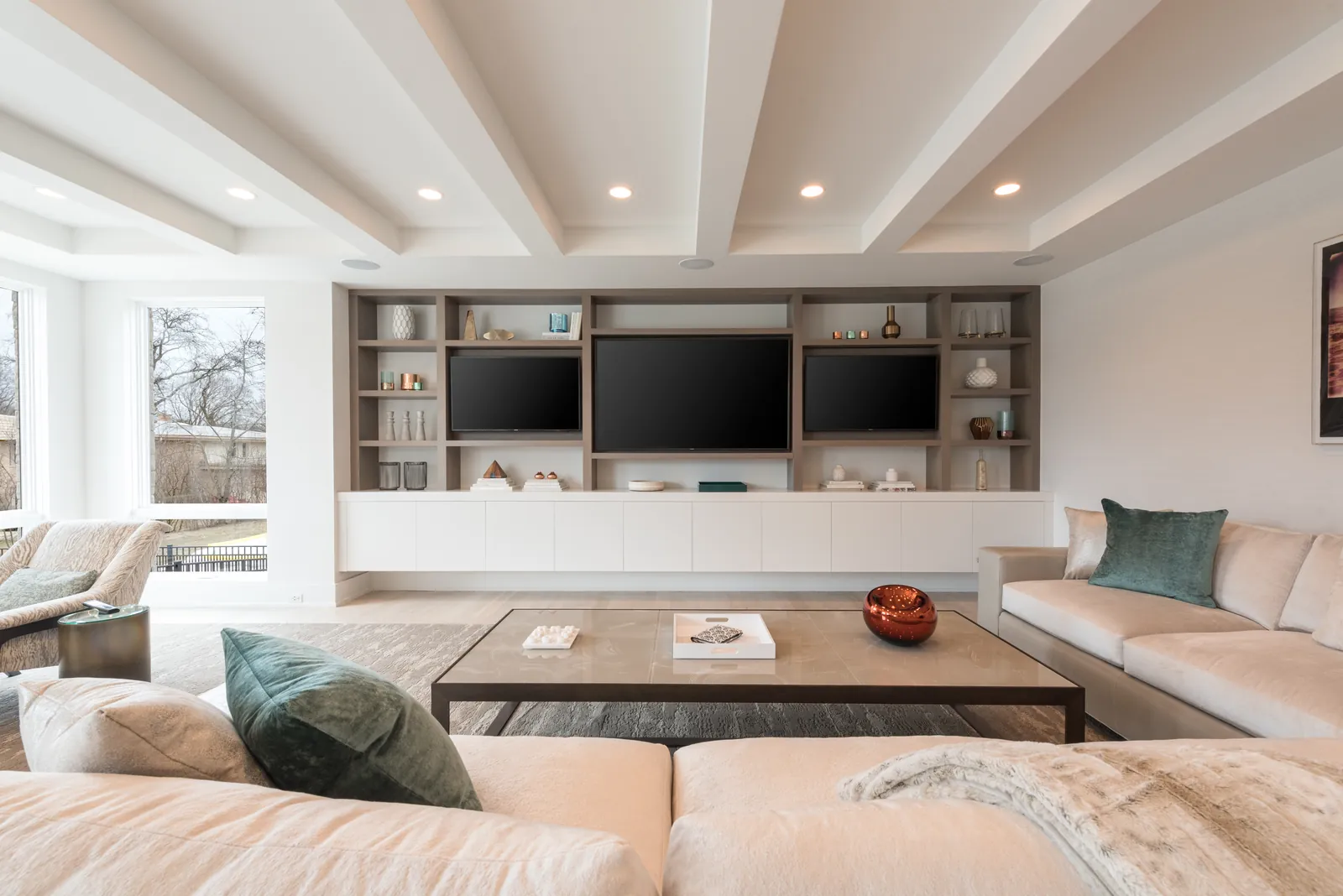Wall-mounted television with concealed wiring in a finished living space