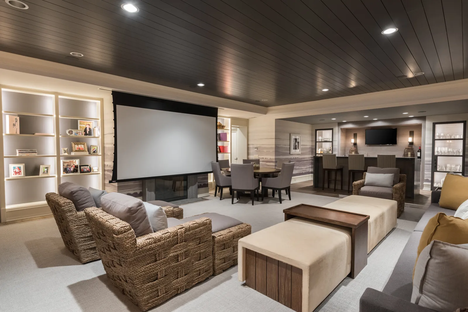 Finished private home theater with projection screen and tiered seating
