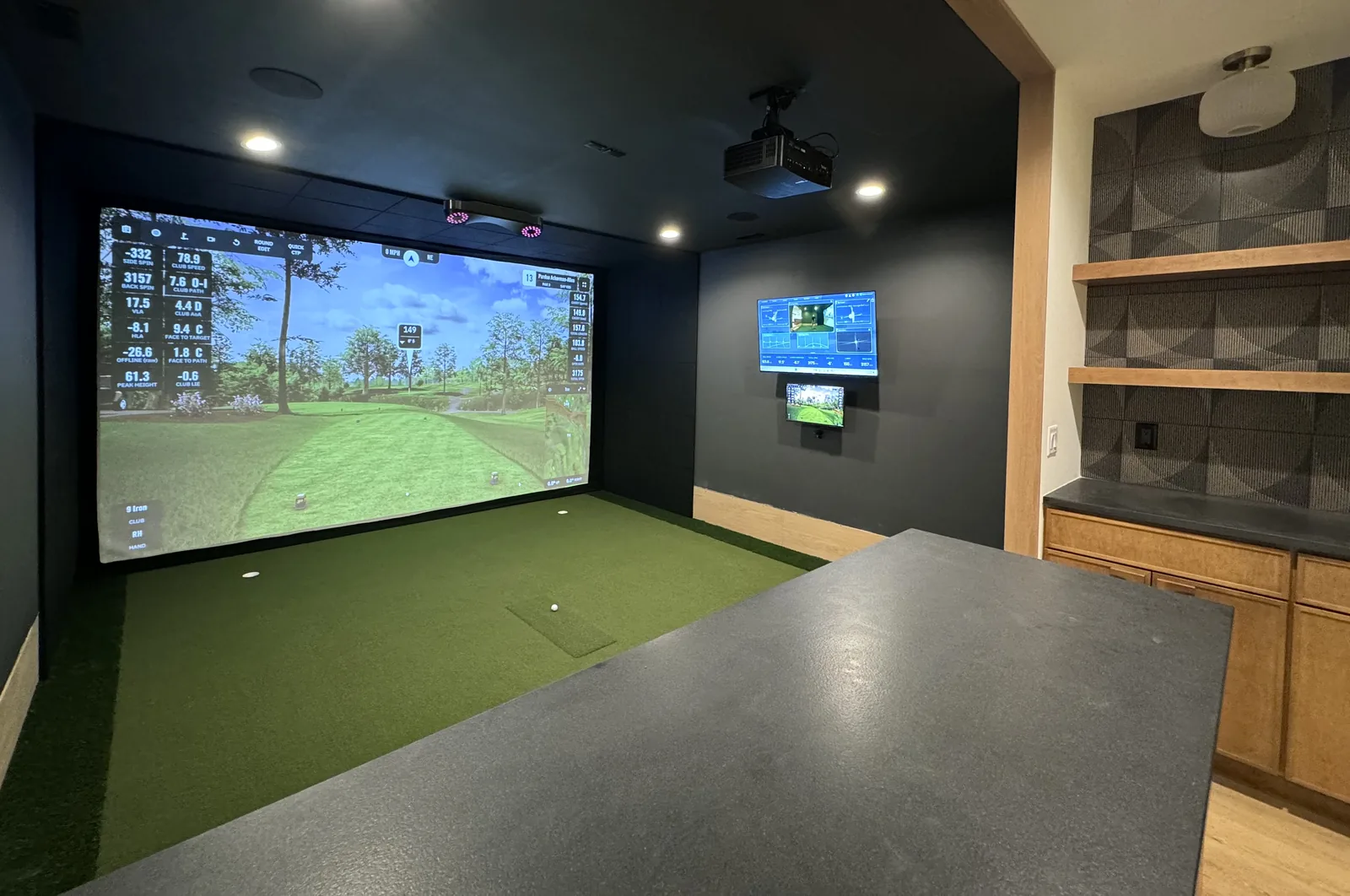 Golf simulator room with integrated lighting, audio, and smart home control
